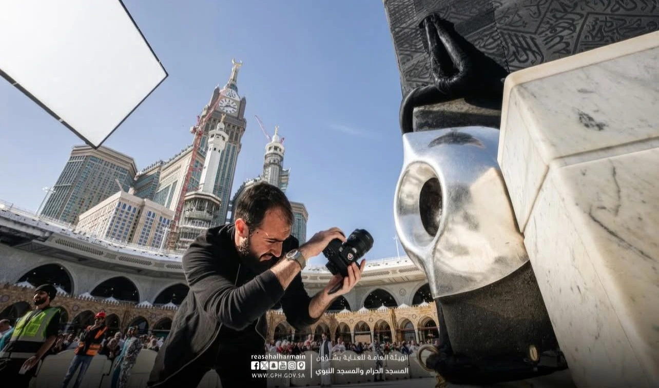 Behind-the-scenes of Shoayb photographing the Black Stone inside an empty Kaaba sanctuary during a rare architectural and fine art project